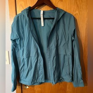 Never worn blue lululemon rain jacket